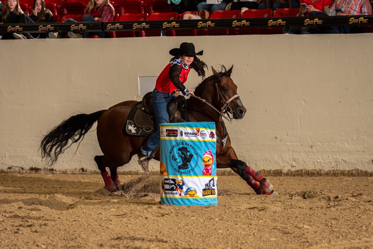 Sami competing in barrel racing at Buckles & Barrels for Bailey